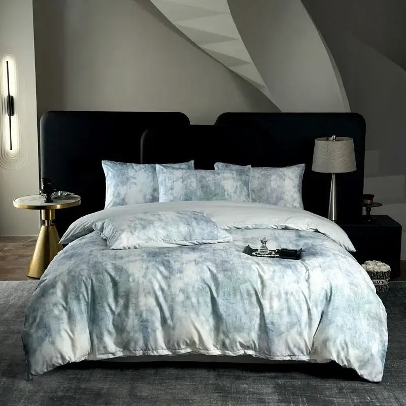 Luxurious light blue and white tie dye cotton bedding set with a soft silky texture by decorbites for bedroom decor