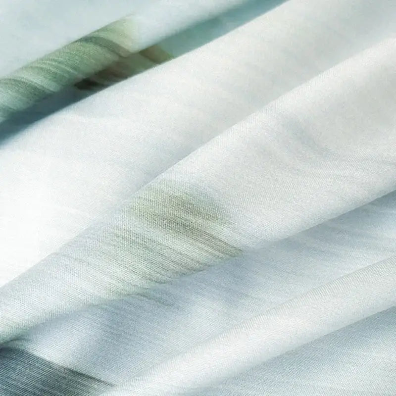 A soft flowing white cotton bedding set with subtle green and gray gradient stripes for decorbites cotton bedding use