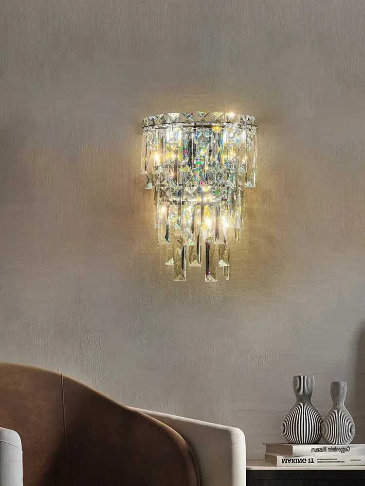 A tiered cascading crystal wall light with a sleek metallic frame for luxury living room decorbites crystal wall use
