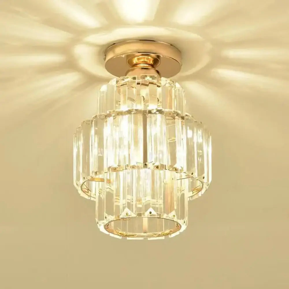 A tiered decorbites black gold minimalist led chandelier with gold-toned metal and clear glass prisms in concentric rings