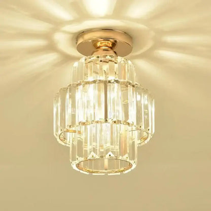 A tiered decorbites black gold minimalist led chandelier with gold-toned metal and clear glass prisms in concentric rings