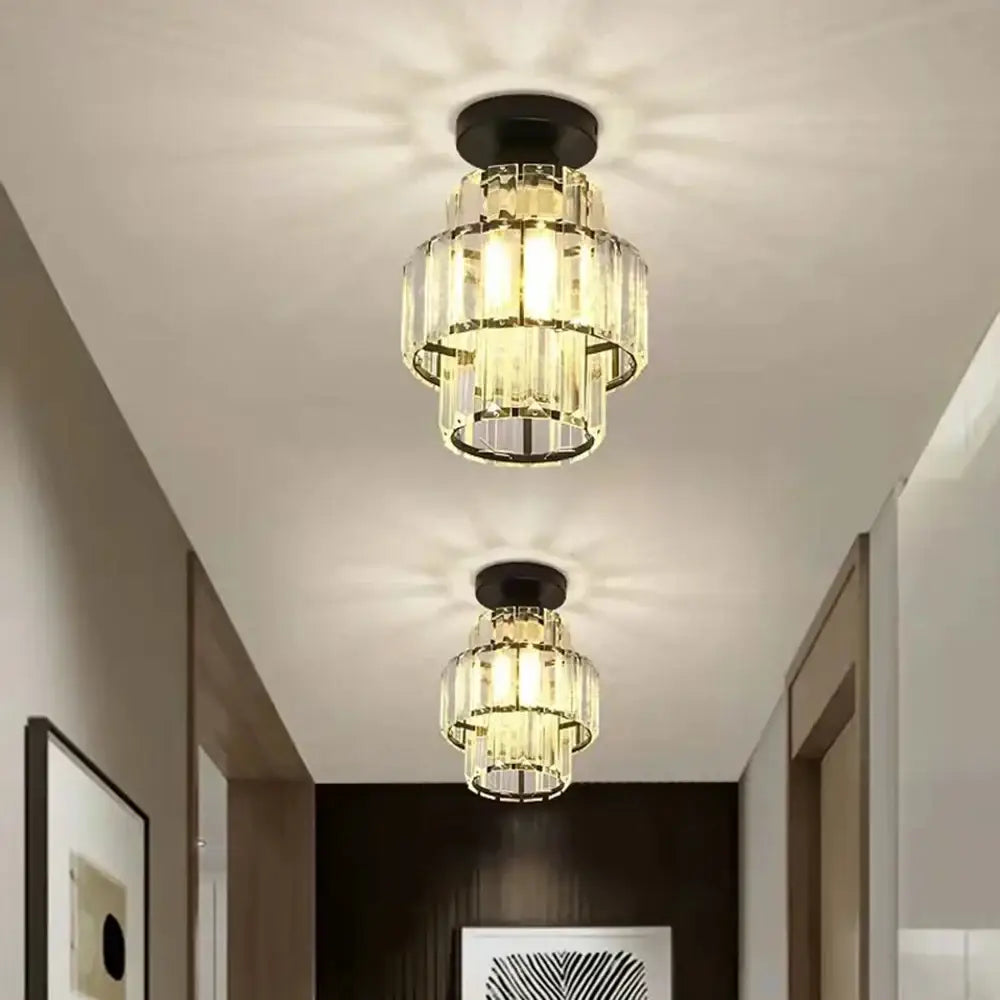Two tiered decorbites black gold minimalist led chandeliers with black metal bases and warm glowing lights for kitchen lighting