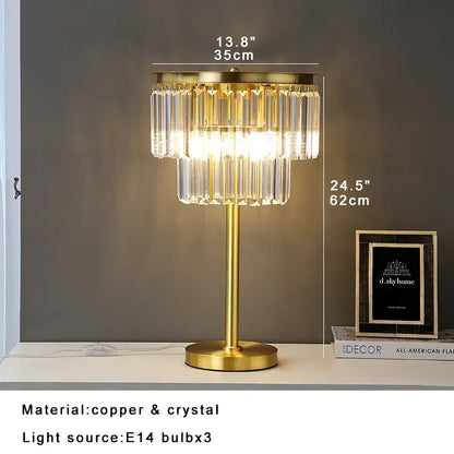 Gold-toned tiered crystal table lamp with slender stem and circular base for bedroom nightstand decorbites crystal table