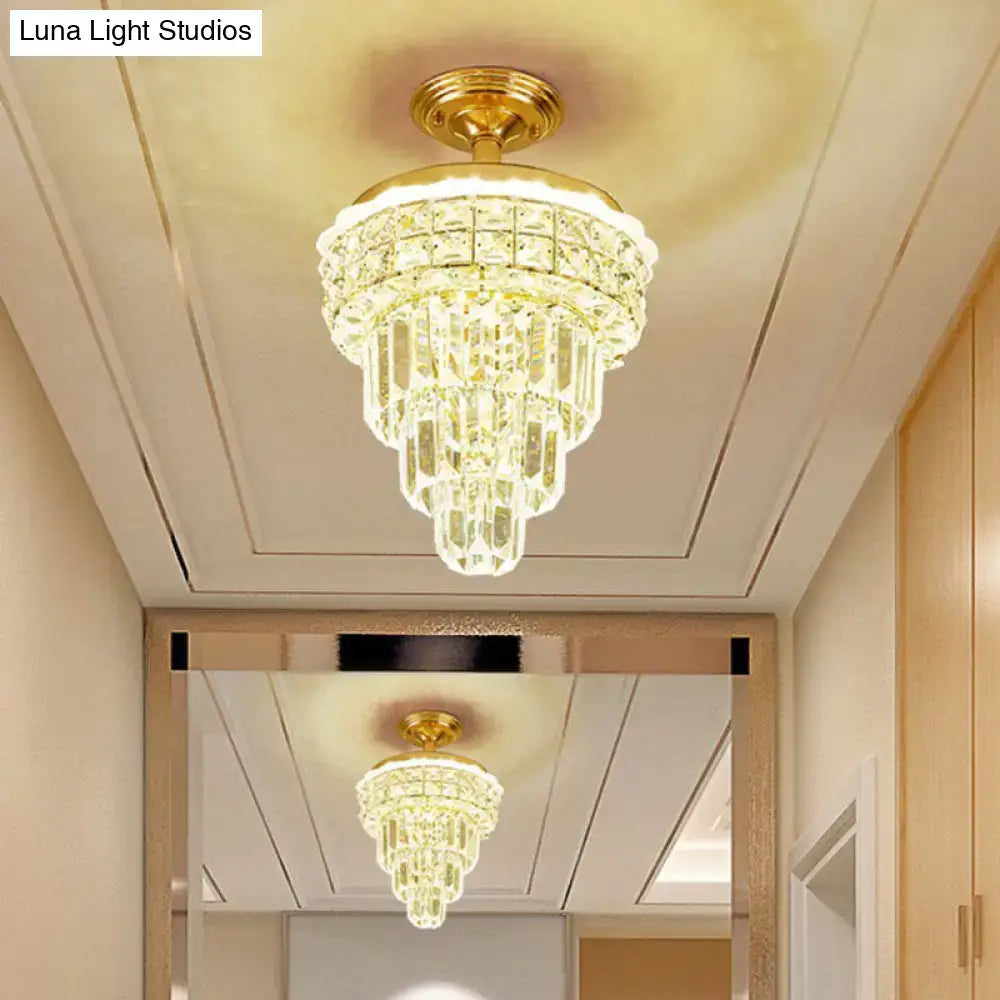 Tiered gold and decorbites optical crystal foyer chandelier with cascading clear crystal prisms 24 inch fixture