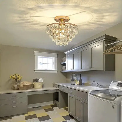 Tiered gold crystal led chandelier ceiling lamp featuring a gold-toned metal frame with clear crystal droplets decorbites crystal led