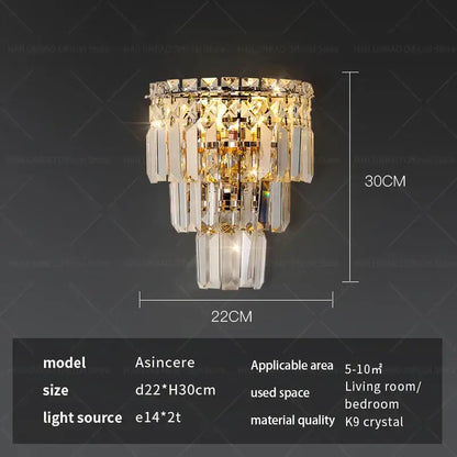 Gold-toned tiered crystal wall lamp with faceted k9 glass prisms and polished metal frame decorbites crystal wall lamp