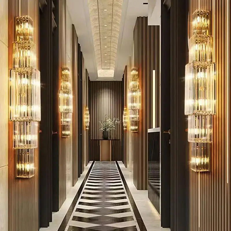 Tiered gold crystal wall lamp with cylindrical glass elements for elegant living room decorbites crystal wall lamp