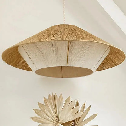 A woven conical pendant light with natural beige finish featuring hemp rope rattan radial texture for warm dining room decorbites hemp rope