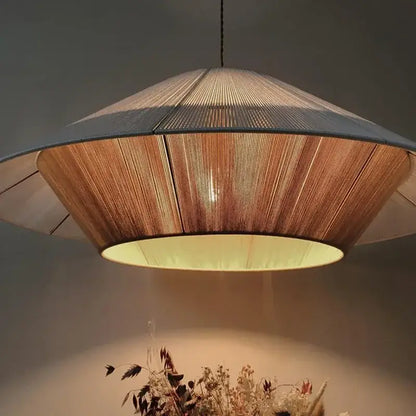 A warm-toned conical pendant light with woven bamboo shade and soft yellow lining for dining room decorbites hemp rope rattan