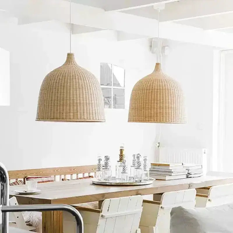 Two beige woven wicker pendant lights featuring tiered natural bamboo weaving led design for dining room use
