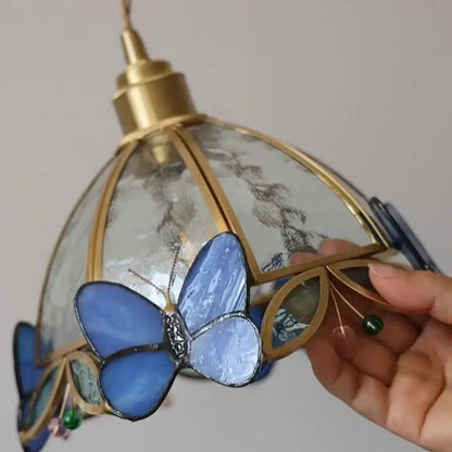 Blue stained glass butterfly pendant wall lamp with gold-toned brass frame and clear textured panels for decorbites tiffany butterfly glass