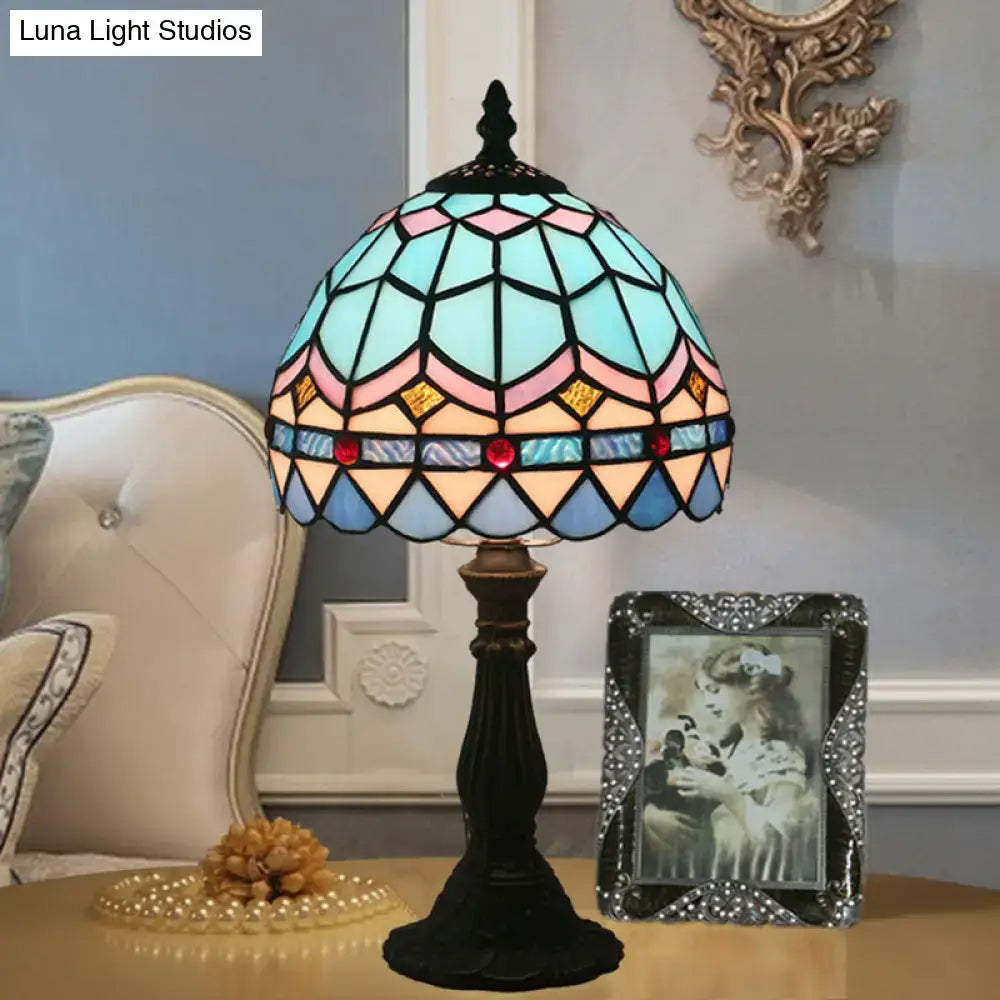 Tiffany stained glass table lamp with dome shade in blue and pink featuring geometric patterns and red jewel accents 110v-120v