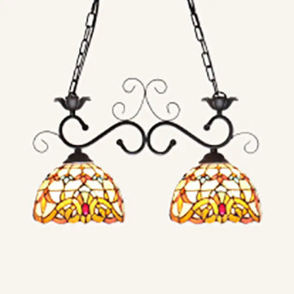 Decorbites stainless glass pendant light with black wrought iron arms and stained glass shades in sunflower pattern
