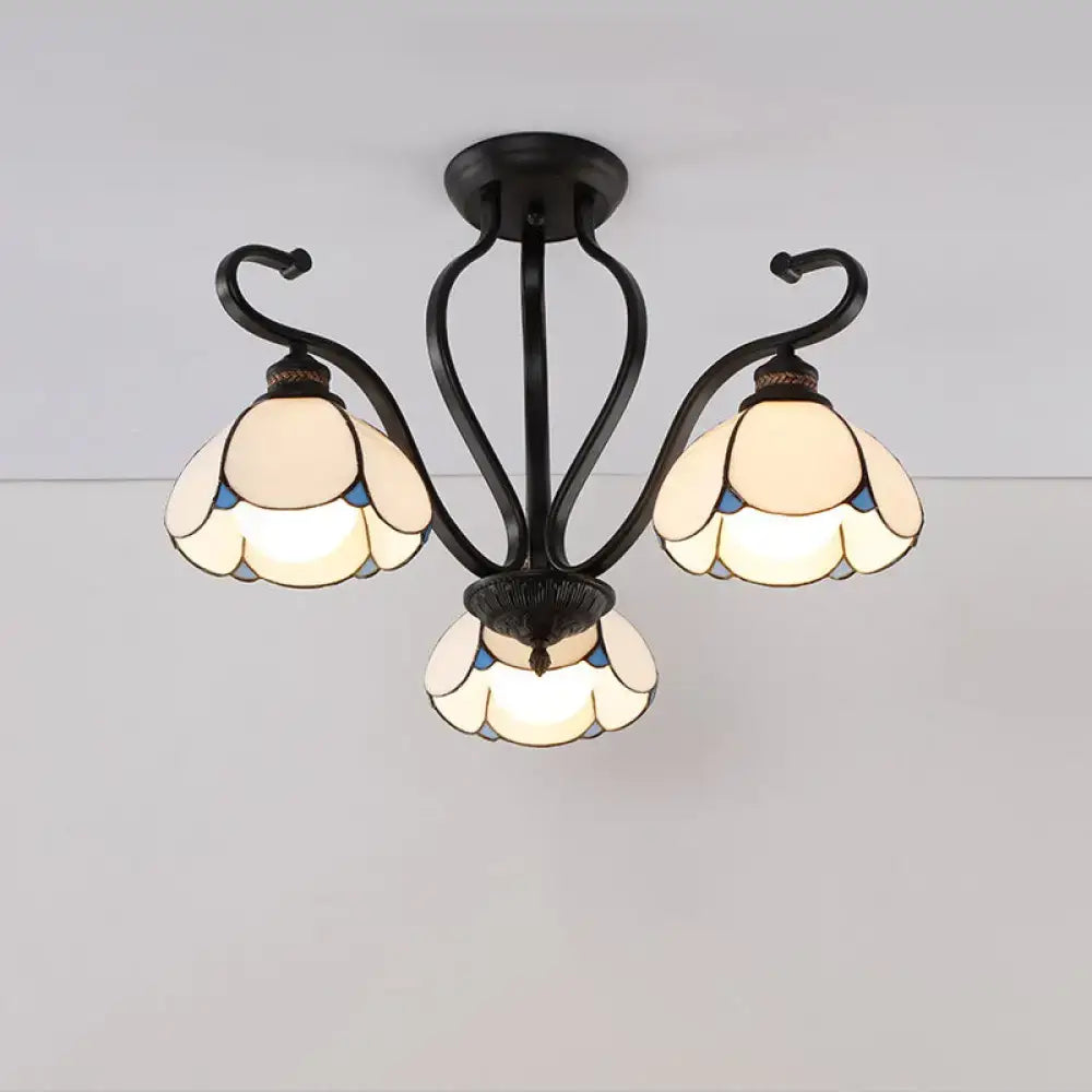 Black wrought iron DecorBites™ semi-flush mount chandelier with three cream and blue stained glass flower shades for living room lighting