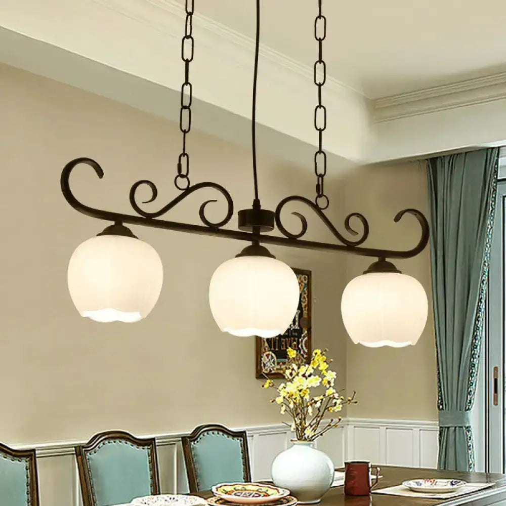 DecorBites traditional black wrought iron island lighting fixture with three milky glass globe shades for dining room