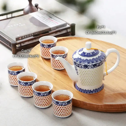 White porcelain tea set teapot with blue white porcelain floral geometric patterns and textured honeycomb decorbites blue white