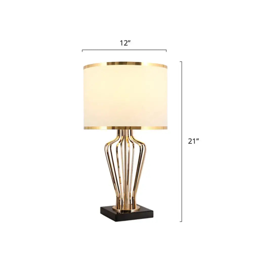 Gold-toned decorbites traditional single brass table light with cream drum shade on black pedestal e26 e27 110v-120v
