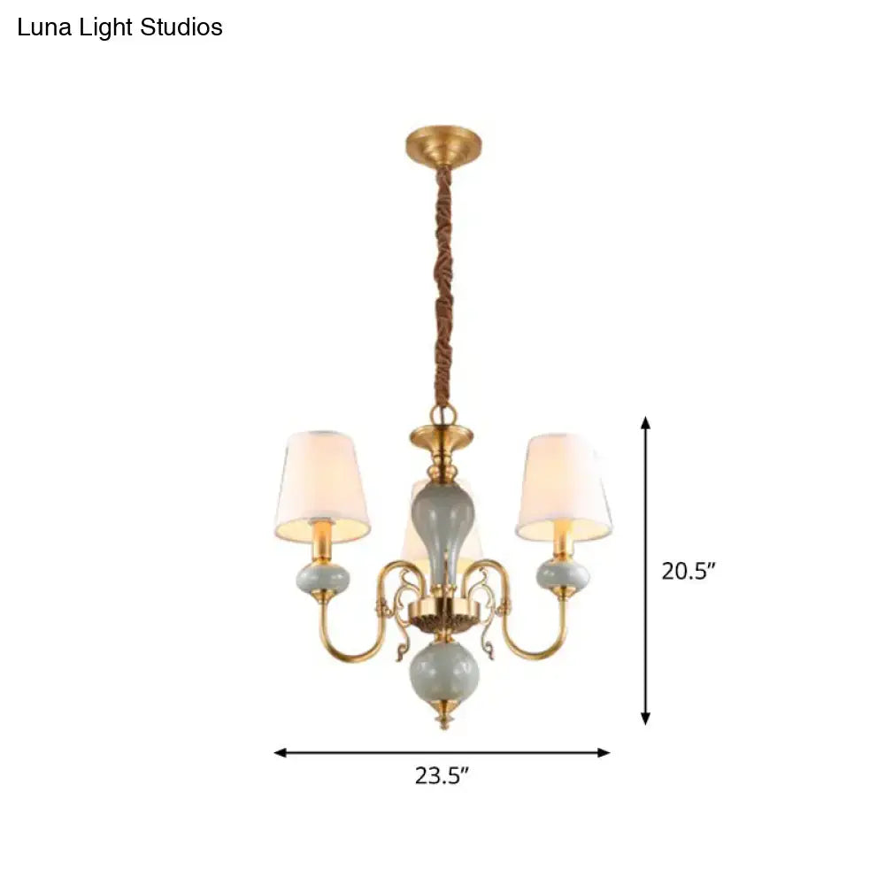 Antique brass and pale green ceramic chandelier with three frosted glass shades for dining room lighting