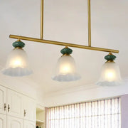 Traditional gold and teal kitchen island bar pendant light with cream glass shades and frosted glass accents