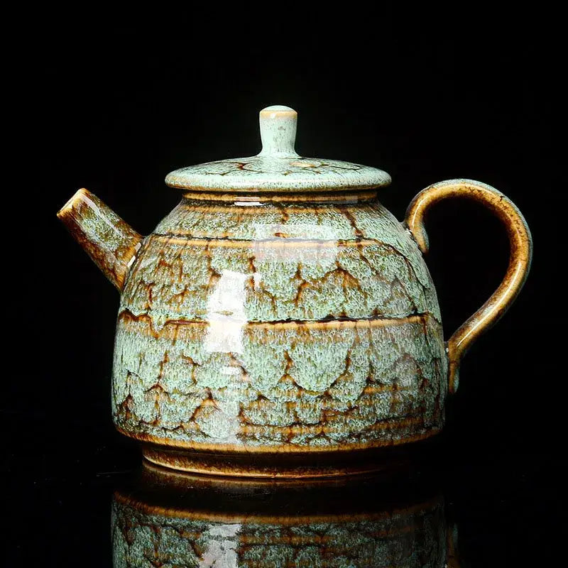 Traditional pink and brown crackle ceramic kung fu tea pot with rounded body and curved handle for tea serving decorbites ceramic kung
