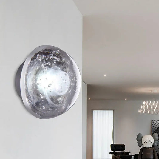 Traditional silver clear crystal bubble wall light 10 inches wide with a textured spherical design for bedroom use