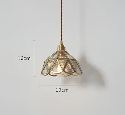 Translucent blue glass pendant light with brass frame features a geometric faceted shade for warm dining room decorbites blue glass pendant lights