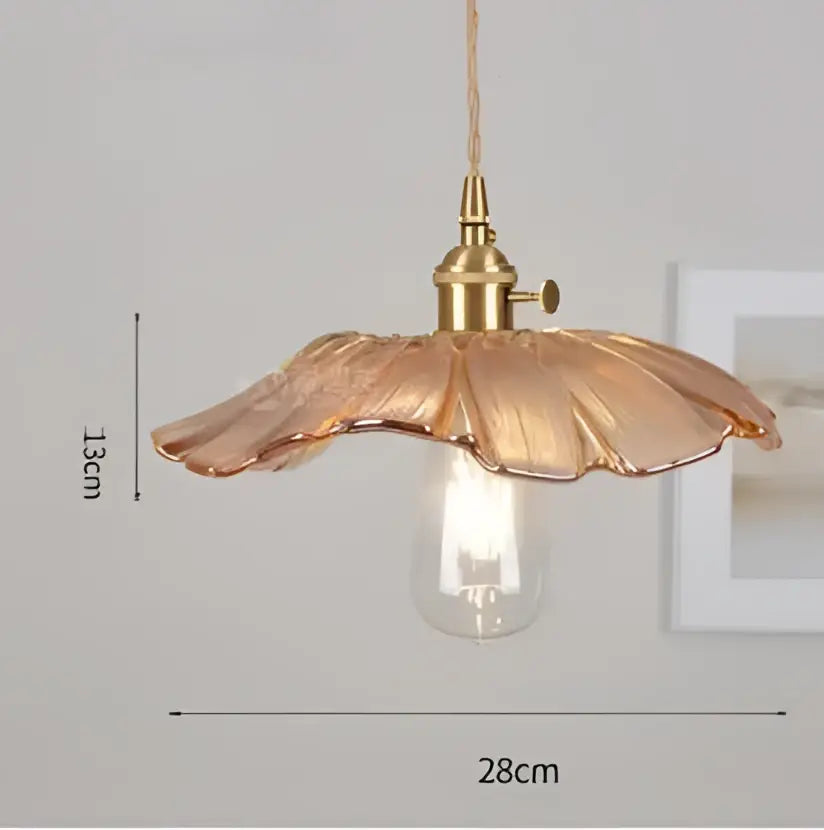 A delicate golden-toned glass pendant light with petal-shaped shade and exposed bulb for decorbites blue glass pendant