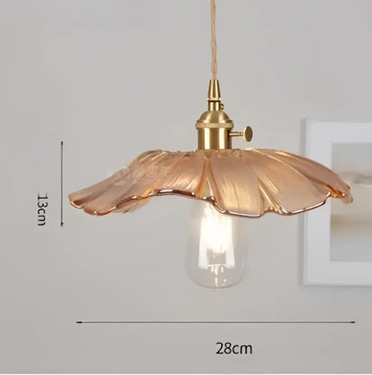 A delicate golden-toned glass pendant light with petal-shaped shade and exposed bulb for decorbites blue glass pendant
