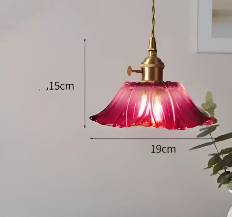 Vibrant red petal-shaped glass pendant light with brass fixture complements decorbites blue glass pendant lights collection