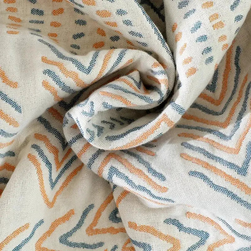 Tribal beige quilted cotton sofa throw blanket with off-white fabric and orange teal zigzag pattern for living room use