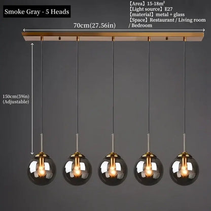 Smoke gray spherical pendant light with five glass globes and brass bar for dining room polished steel fixture
