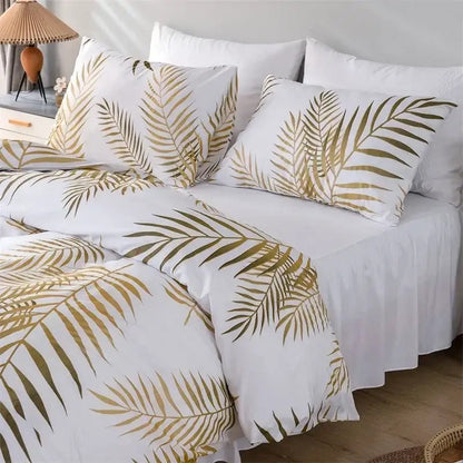 White duvet set with matching pillowcases featuring bold golden palm leaf pattern for tropical bedding solution decorbites gold print