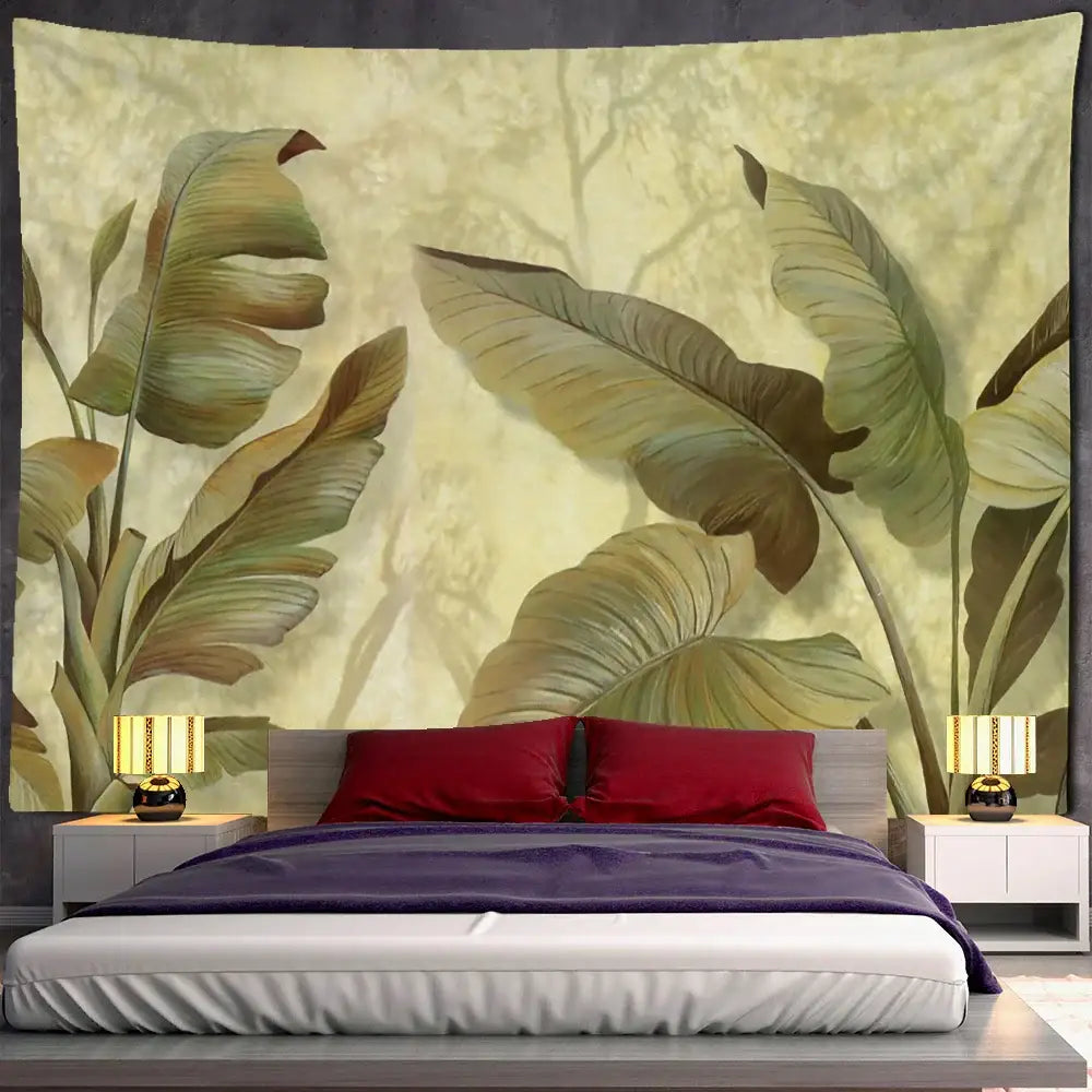 A large beige and green tropical banana leaf tapestry wall hanging above a bed for bedroom decor
