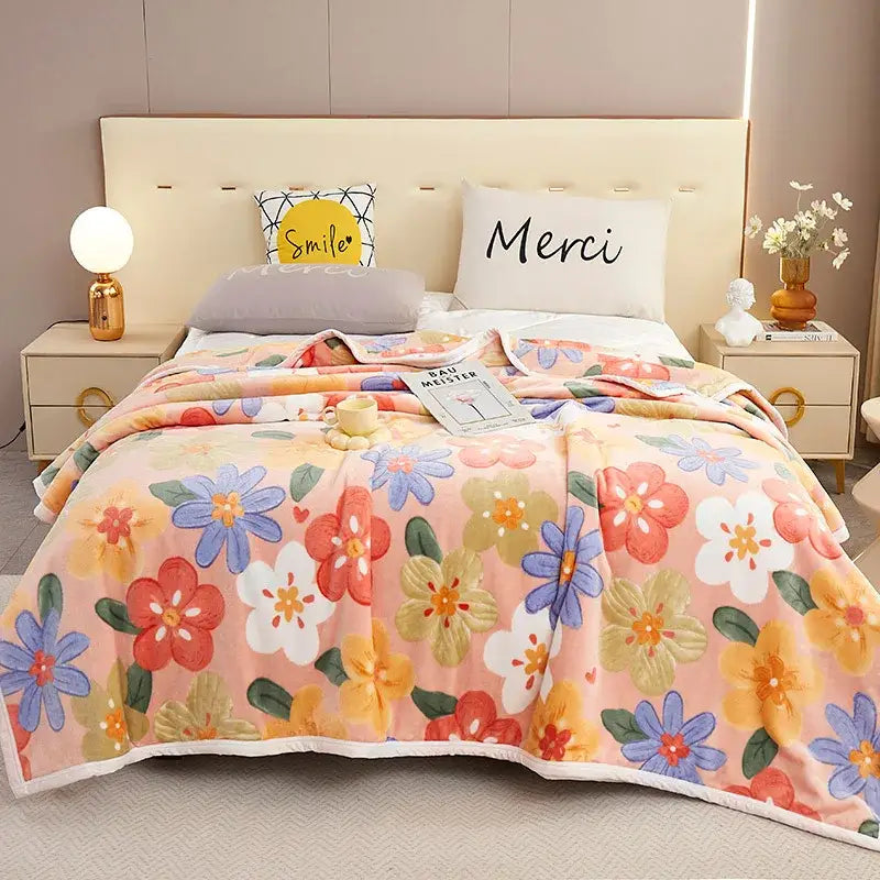 A cozy flannel blanket from decorbites featuring a plush peach floral design perfect as a bedroom throw