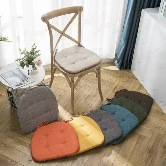Cozy tufted beige dining chair cushions with soft textured weave fabric, ideal decorbites dining chair accessory