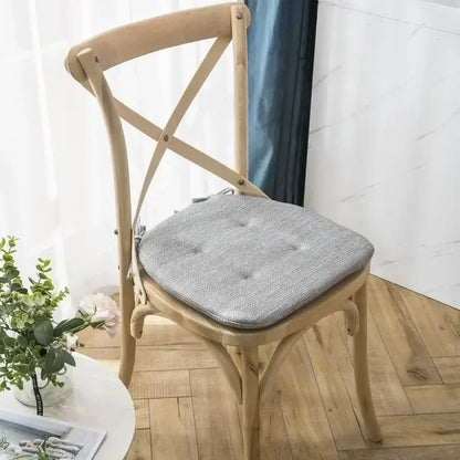 Gray tufted fabric chair cushion with subtle woven texture designed for decorbites dining chair wooden cross-back chairs