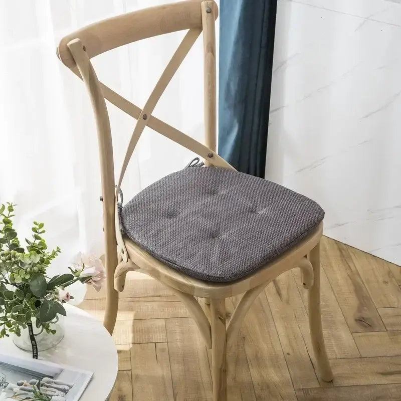 Gray tufted fabric chair cushion with subtle textured weave designed for decorbites dining chair seat pads