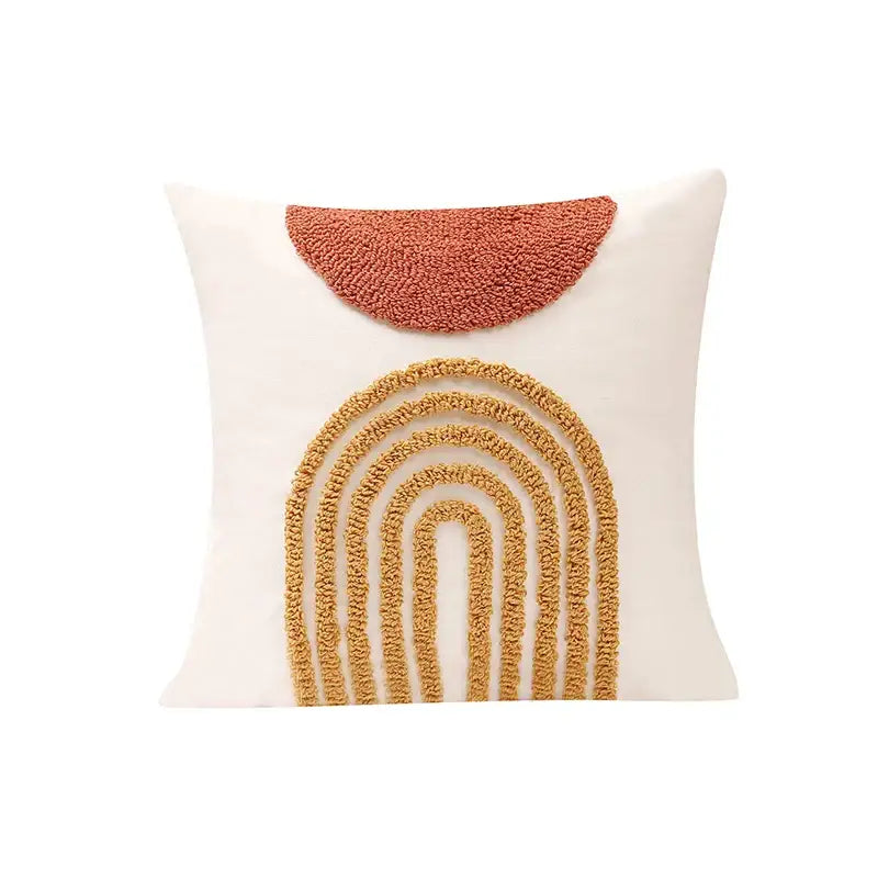 Cream-colored cushion cover with textured terracotta half-circle and layered mustard-yellow arch decorbites gematric tufted design
