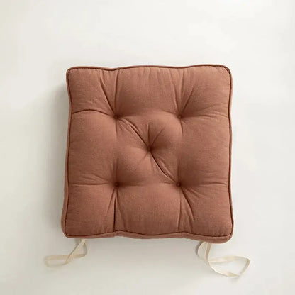 Square tufted button cushion in soft terracotta fabric with matching ties for living room decorbites button cushion