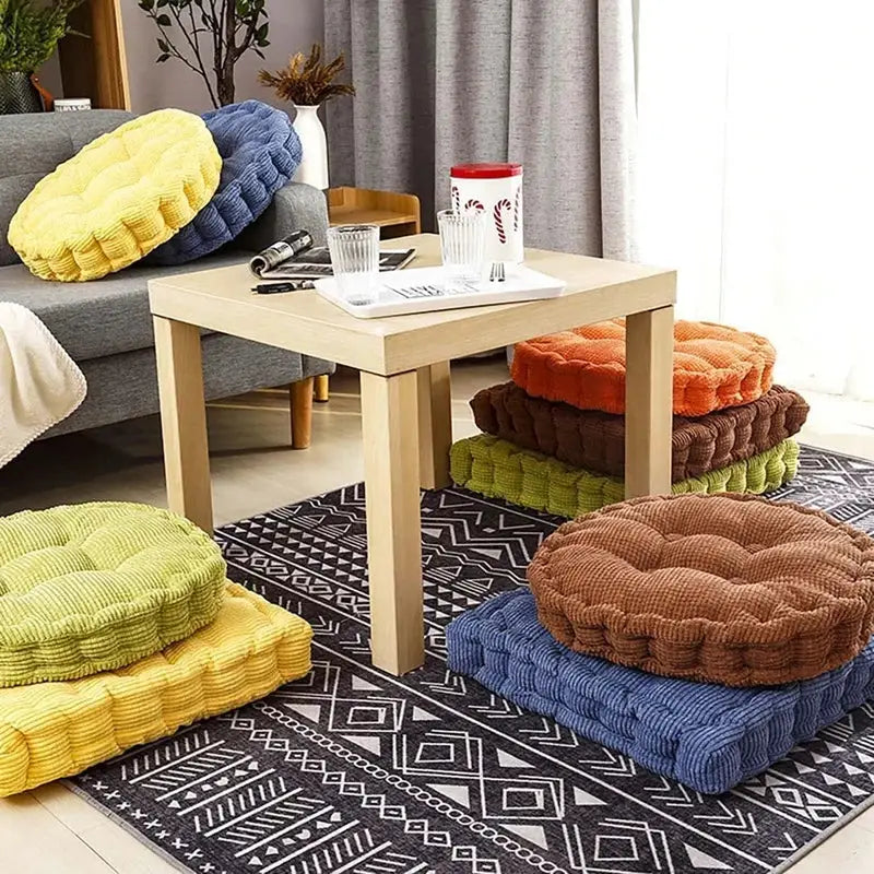 Stacked decorbites corduroy tufted floor seat cushions in vibrant yellow blue orange brown and green for living room decor