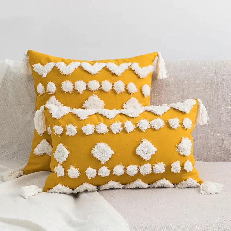 Vibrant mustard-yellow cushion cover with tufted tassels and textured pom-poms for decorbites boho style decor