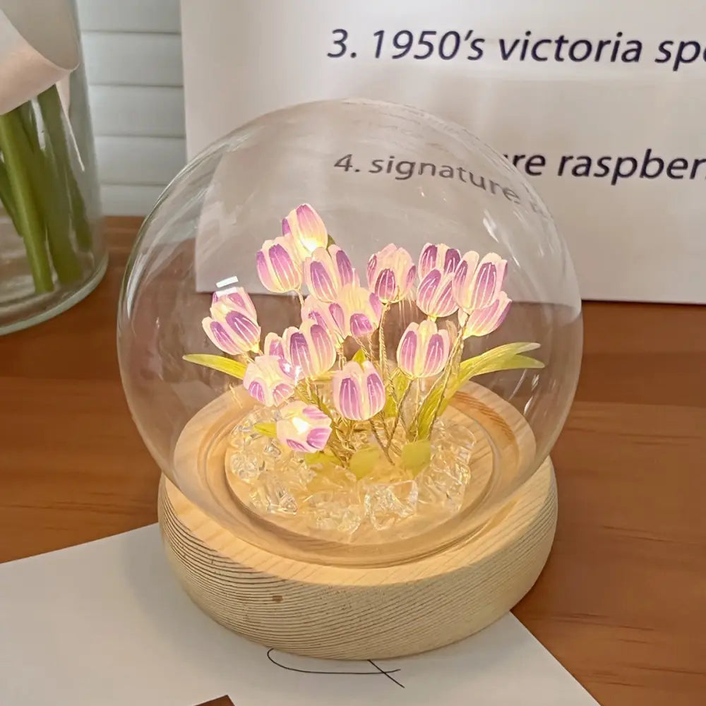 Decorbites tulip night light with illuminated pink and white LED tulips in a clear glass dome on a wood base