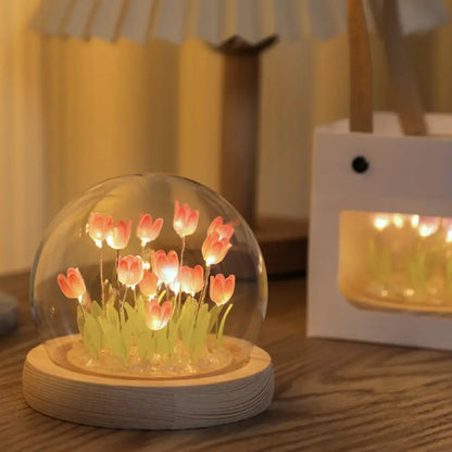 Decorbites tulip night light featuring illuminated pink tulips in a glass dome on a wooden base for bedside use