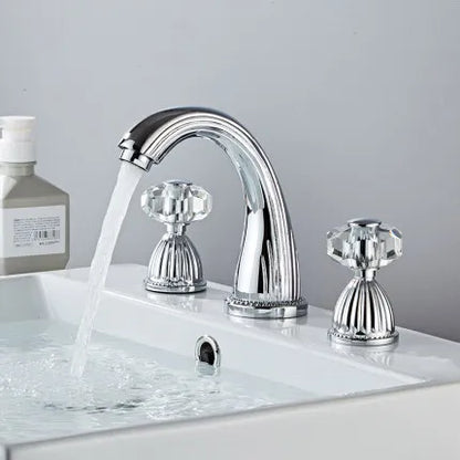 Chrome-finished Tuqiu gold brass basin faucet with three crystal handles for hot and cold water in a bathroom sink