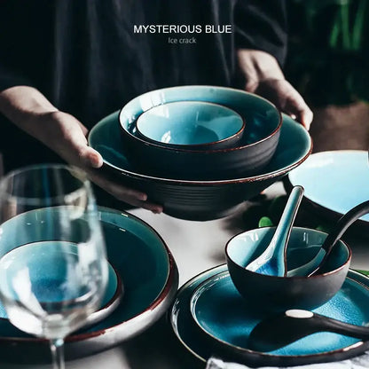 Mysterious blue ice crack ceramic tableware set with deep teal interiors and dark brown rims featuring ice cracking glaze
