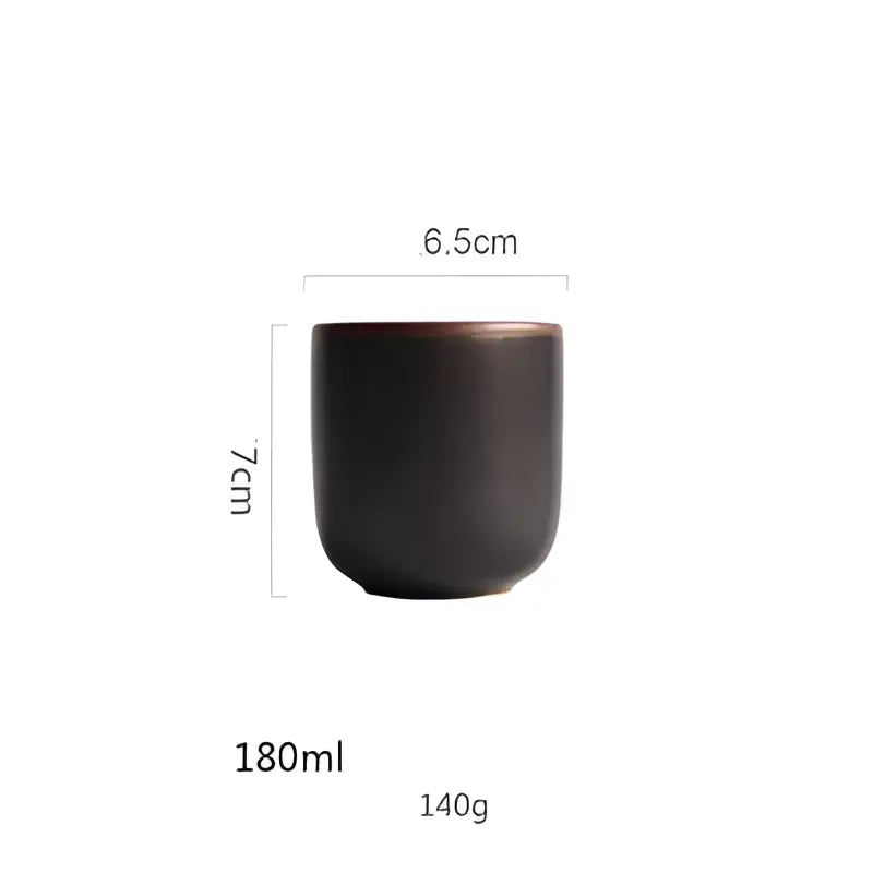 A sleek dark brown ceramic teacup with matte finish and rounded edges in a turquoise ice cracking glaze tableware set