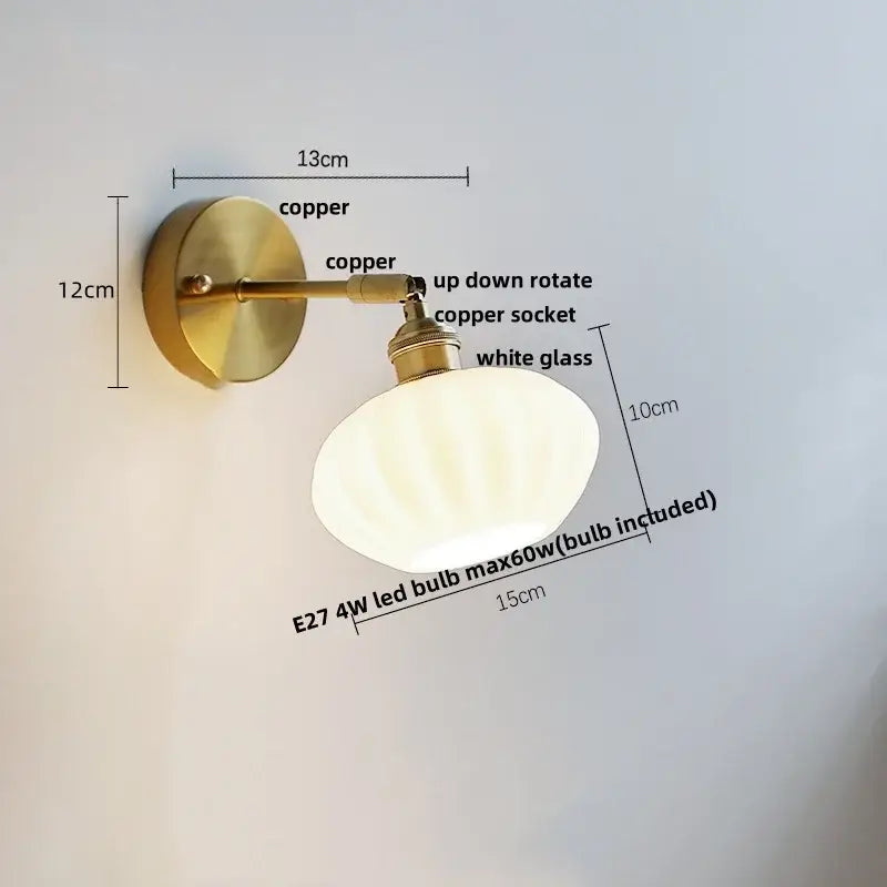 Vintage-style wall sconce with polished copper finish and white glass shade for decorbites blue glass wall decor