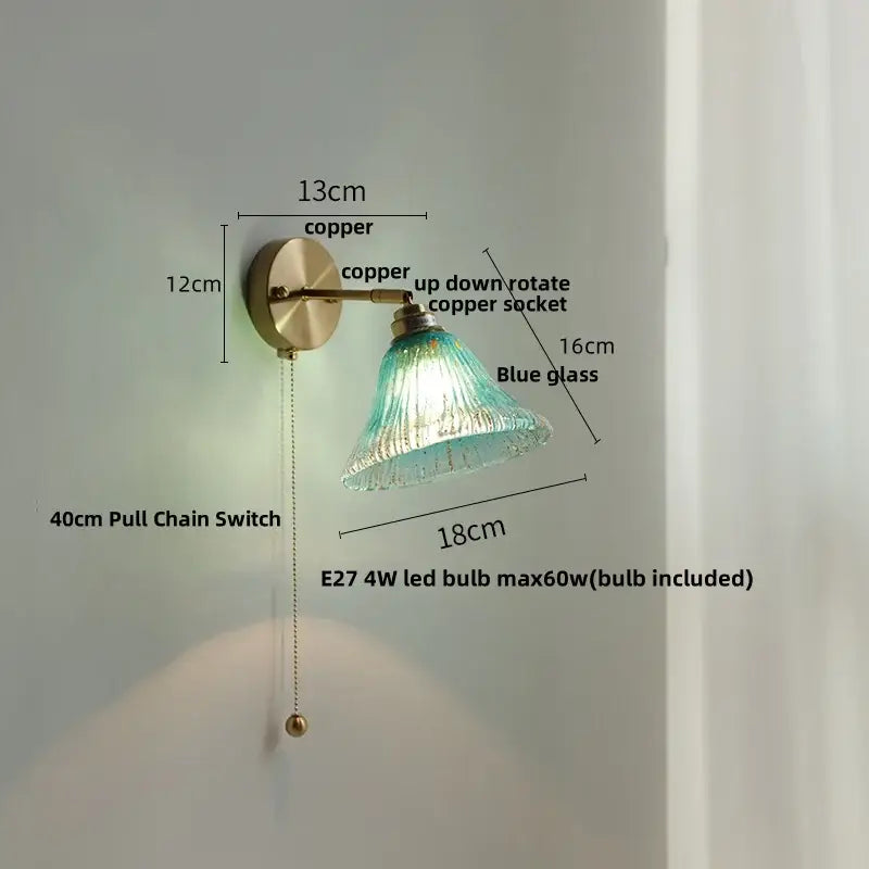 Turquoise textured blue glass wall sconce with copper finish and pull chain for staircase decorbites blue glass wall