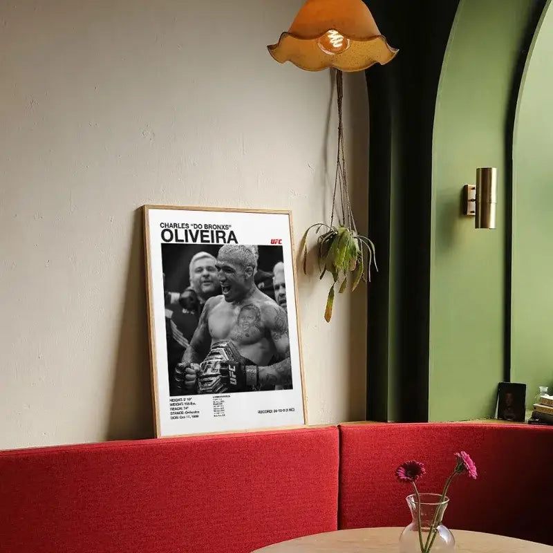 A framed black and white ufc canvas print of fighter charles do bronx oliveira with stats for gym decor