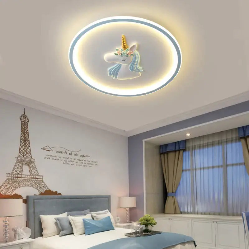 Round kids ceiling lights featuring a glowing unicorn design in pastel blue white with gold horn accents for decorbites cartoon kids decor